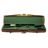 A LEATHER FULL-LENGTH RIFLE CASE, fitted for a 46 1/2in. rifle, the interior lined with green baize,