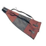 A PAIR OF CANVAS AND LEATHER RIFLE SLIPS, with leather shoulder strap and brass fittings.