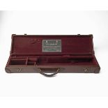 E.J. CHURCHILL A LIGHTWEIGHT LEATHER SINGLE GUNCASE, fitted for 25in. barrels, the interior lined