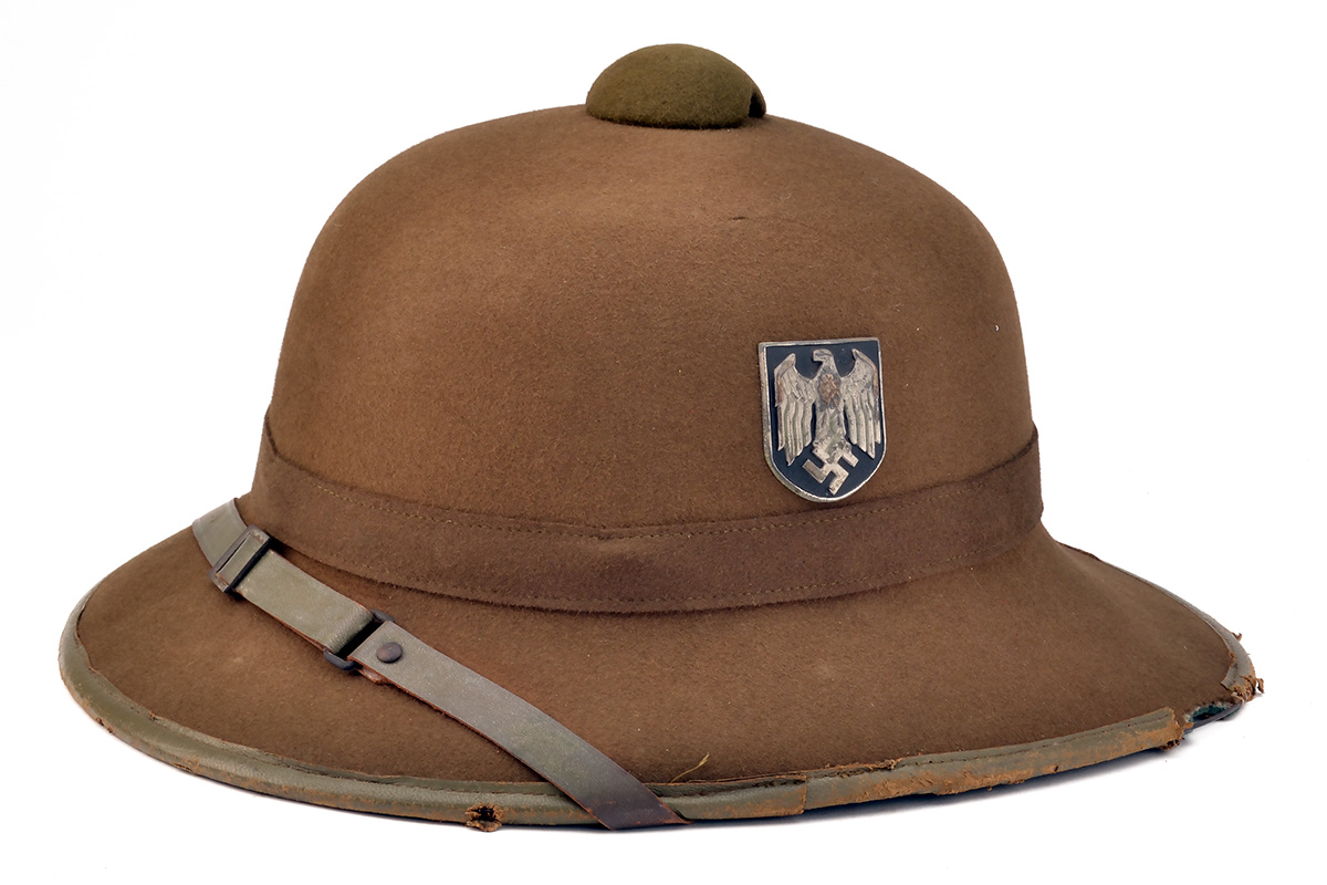 A GERMAN WORLD WAR TWO OFFICER QUALITY TROPICAL SUN HELMET, dated for 1942 and probably a private