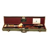 JOHN WILKES A BRASS-CORNERED GREEN CANVAS AND LEATHER FULL-LENGTH RIFLE CASE, fitted for a 47in.