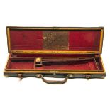 COGSWELL & HARRISON A BRASS-CORNERED OAK AND LEATHER SINGLE GUNCASE, fitted for 30in. barrels, the