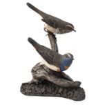 MIKE WOOD A FINE HAND-CARVING OF A PAIR OF BLUETHROATS, showing a perched male and female, measuring