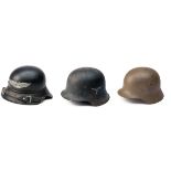 THREE ASSORTED GERMAN WORLD WAR TWO STEEL HELMETS, including an example for the Luftschutz (fine
