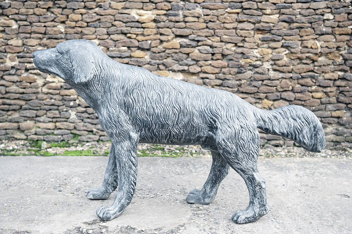 A CAST STEEL LIFE SIZE RETRIEVER, measuring approx. 28in. x 25in. x 9in..
