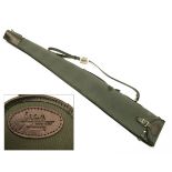 A GREEN CANVAS AND LEATHER FLEECE-LINED SINGLE GUNSLIP, with leather shoulder strap and brass