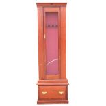 GARDNER & BANNISTER A GLASS FRONTED STEEL GUN CABINET, with steel body, 1in. bullet resistant