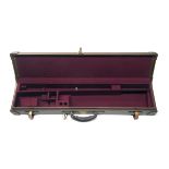 A BROWN LEATHER SINGLE GUNCASE, fitted for 30in. barrels, the interior lined with maroon baize,