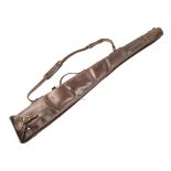 A LEATHER SHEEPSKIN-LINED SINGLE GUNSLIP, measuring approx. 48in., leather shoulder strap and