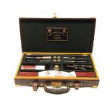 JAMES PURDEY & SONS LTD. A FINE HANDMADE LEATHER CASED GUN CLEANING KIT, consisting of a two-piece