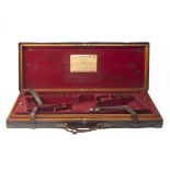 STEPHEN GRANT & JOSEPH LANG A BRASS-CORNERED OAK AND LEATHER DOUBLE GUNCASE, fitted for 29in.