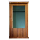 A GLASS-FRONTED GUN CABINET, an eight gun safe with an oak finish, the interior lined with red