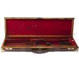 A BRASS-CORNERED OAK AND LEATHER SINGLE HAMMERGUN CASE, fitted for 30in. barrels, the interior lined