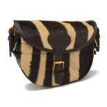 A ZEBRA FUR AND LEATHER LARGE CARTRIDGE BAG, with canvas and leather shoulder strap and brass