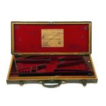 COGSWELL & HARRISON A BRASS-CORNERED OAK AND LEATHER DOUBLE GUNCASE, fitted for 30in. barrels, the