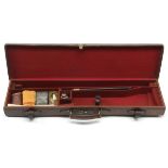 A LEATHER SINGLE GUNCASE, fitted for 30in. barrels, the interior lined with red baize, three-piece