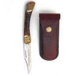 PUMA, GERMANY A HAND-ENGRAVED FOLDING SPORTING-KNIFE, MODEL '910 PUMA PRINCE', serial no. 34873, for