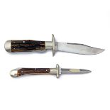 MARBLES, USA A FOLDING BOWIE-KNIFE TOGETHER WITH A FOLDING DAGGER SIGNED PUMA, MODEL '563 MEDICI',