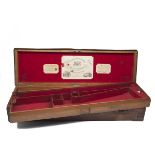 WILLIAM ROCHESTER PAPE A BRASS-CORNERED OAK AND LEATHER TWO-TIER DOUBLE HAMMERGUN CASE, fitted for