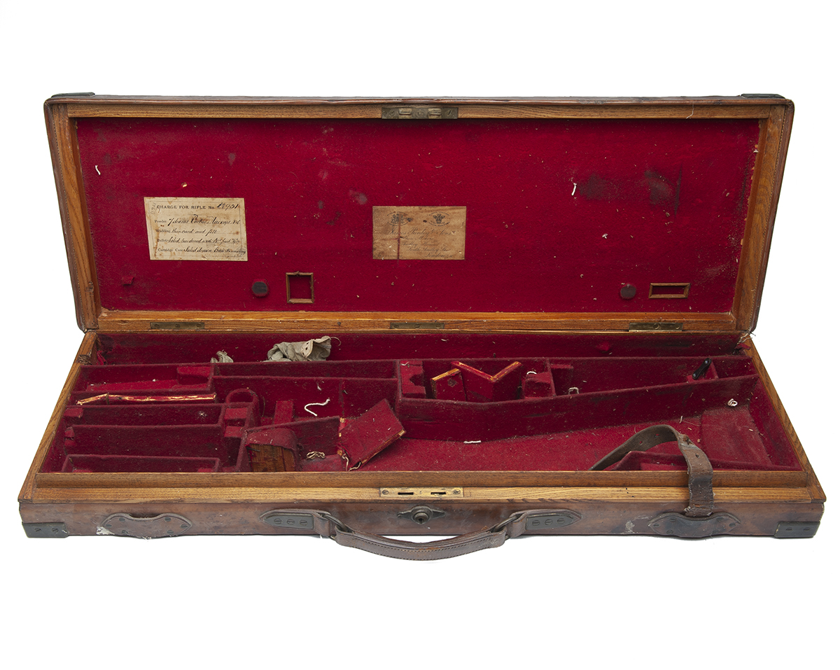 JAMES PURDEY & SONS A BRASS-CORNERED OAK AND LEATHER SINGLE GUNCASE, crudely refitted for 30in.