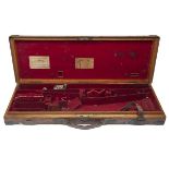 JAMES PURDEY & SONS A BRASS-CORNERED OAK AND LEATHER SINGLE GUNCASE, crudely refitted for 30in.