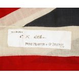 A LARGE UNION FLAG SIGNED 'C.R. ATTLEE THE PRIME MINISTER OF GREAT BRITAIN 1.1.47' 'This Flag by