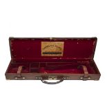 HARRISON & HUSSEY LTD. A BRASS-CORNERED LEATHER SINGLE HAMMERGUN CASE, fitted for 30in. barrel,