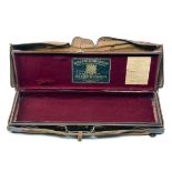 HOLLAND & HOLLAND A LEATHER RIFLE CASE WITH CANVAS OUTER, missing internals, red baize lined