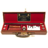 JAMES PURDEY & SONS LTD. A FINE HANDMADE LEATHER CASED GUN CLEANING KIT, consisting of two-piece