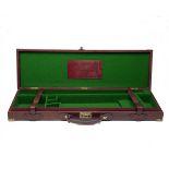 SWAIN ADENEY BRIGG & SONS LTD. A BRASS-CORNERED LEATHER SINGLE GUNCASE, fitted for 29in. barrels (