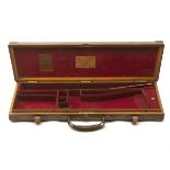 JAMES PURDEY & SONS A BRASS-CORNERED OAK AND LEATHER SINGLE GUNCASE, fitted for 30in. barrels, the