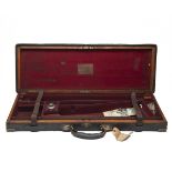 OGDEN SMITHS & HUSSEY A BRASS-CORNERED OAK AND LEATHER SINGLE GUNCASE, fitted for 28in. barrels, the