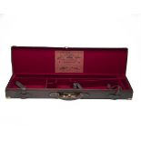 G.E. LEWIS A BRASS-CORNERED LEATHER DOUBLE RIFLE HAMMER GUNCASE, fitted for 30in. barrels, the