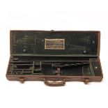 W.W. GREENER A LEATHER SINGLE GUNCASE, fitted for 29in. barrels, the interior lined with green