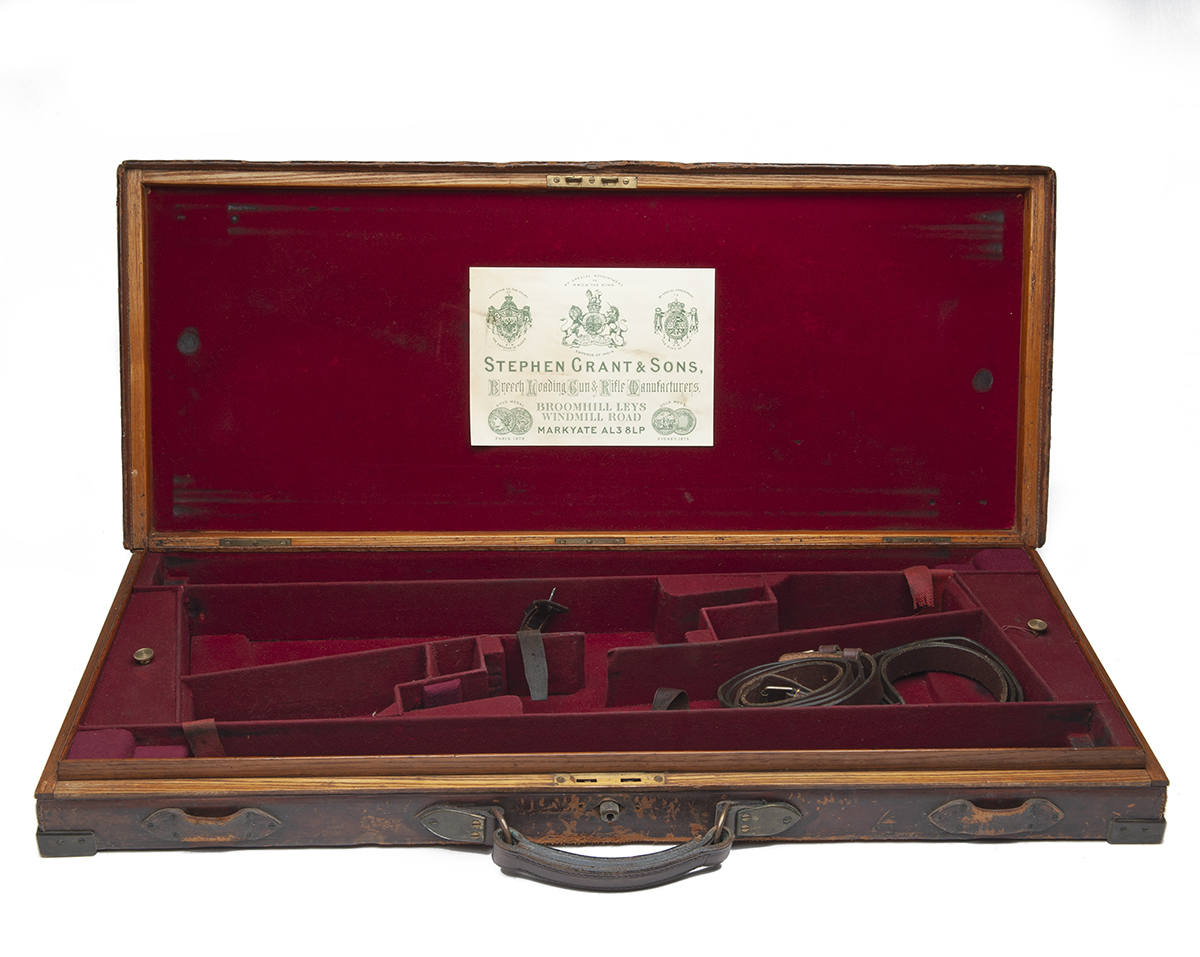 STEPHEN GRANT & SONS A BRASS-CORNERED OAK AND LEATHER DOUBLE GUNCASE, fitted for 29in. barrels (