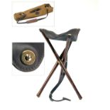 JAMES PURDEY & SONS A FINE UNUSED LIGHTWEIGHT WOOD AND LEATHER TRIPOD SEAT, with leather carry