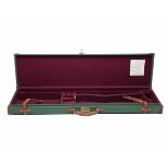 A GREEN CANVAS AND LEATHER SINGLE GUNCASE FOR 36in. BARRELS, the interior lined with maroon baize,