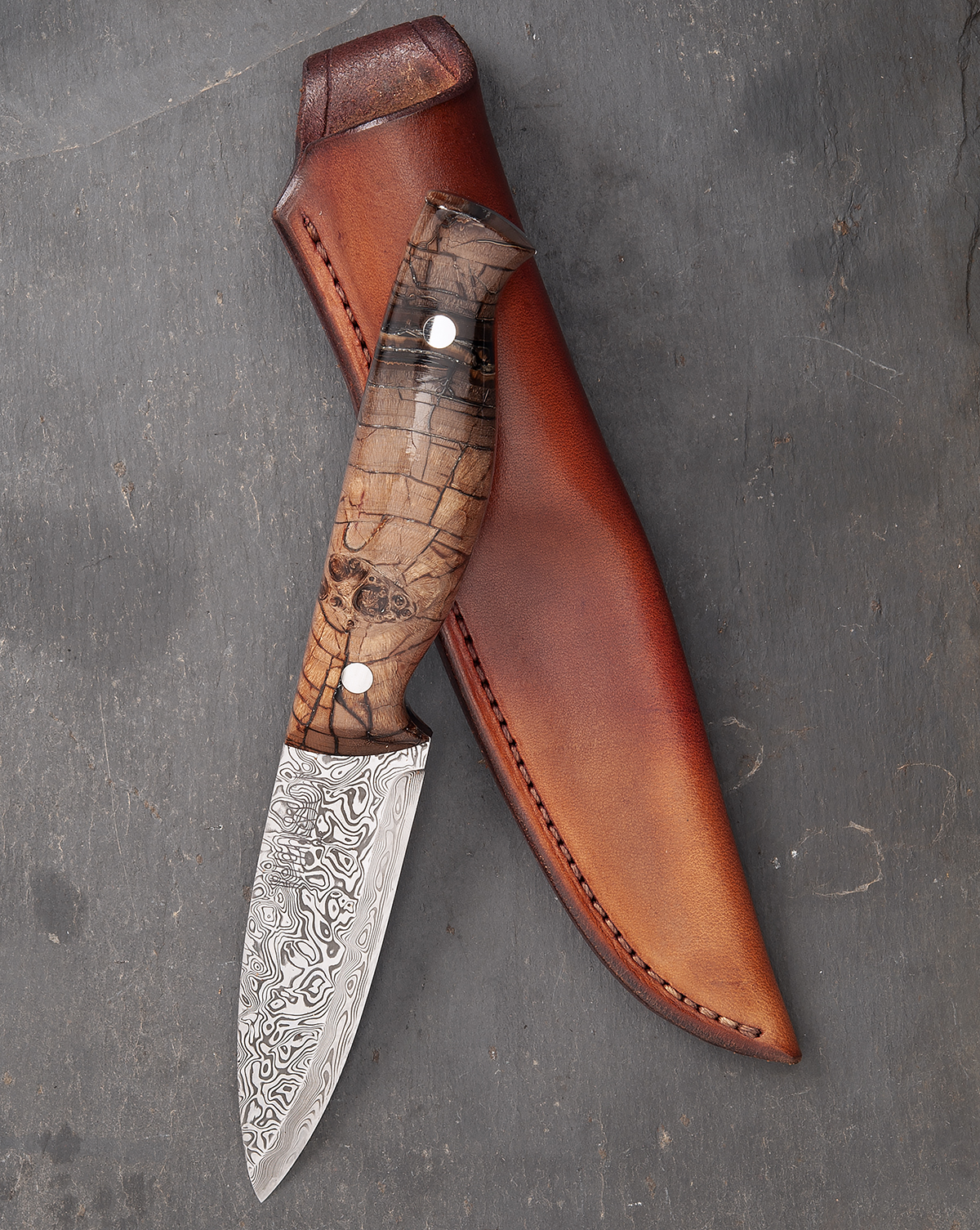 WILLIAM & SON, LONDON A FINE DAMASCUS DROP-POINT HUNTING KNIFE WITH FOSSILISED MAMMOTH-TUSK HILT,