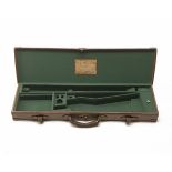 W.J. JEFFERY & CO. A BRASS-CORNERED LEATHER SINGLE GUNCASE, fitted for 30in. barrels, the interior