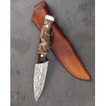WILLIAM & SON, LONDON A FINE DAMASCUS DROP-POINT HUNTING KNIFE WITH FOSSILISED MAMMOTH-TUSK HILT,