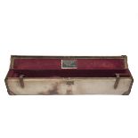 A CANVAS AND LEATHER SINGLE MOTOR CASE, fitted for 29in. barrels, the interior lined with maroon