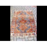 A Middle Eastern rug with geometric border - 140cm
