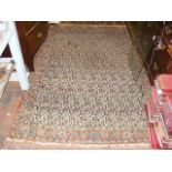 An antique Middle Eastern rug with geometric borde