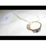 A lady's sapphire and diamond ring in 18ct gold se