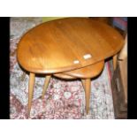 A nest of three retro Ercol Golden Dawn tables