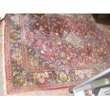 An old Middle Eastern rug with geometric floral bo