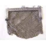 A lady's silver mesh evening bag