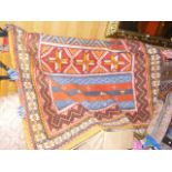 A Middle Eastern style carpet with geometric borde