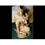 A 15cm high gilt bronze deity figure