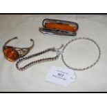 A lady's silver and amber bracelet, cheroot holder